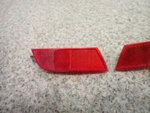 NISSAN NOTE E11 06-12 ODBLASK ZDERZAKA TYLNY 2/5 MINIATURA