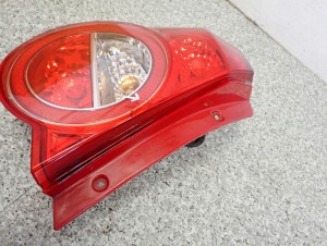 CHEVROLET AVEO T250 07- LAMPA TYLNA LEWA 4/10 MINIATURA
