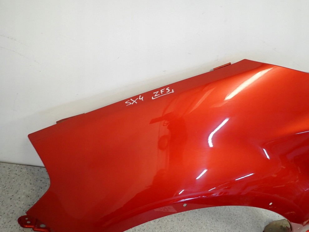 SUZUKI SX4 06-12 BŁOTNIK PRZEDNI LEWY ZFS 4/10