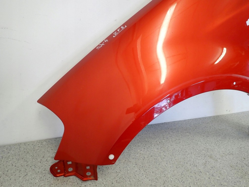 SUZUKI SX4 06-12 BŁOTNIK PRZEDNI LEWY ZFS 5/10