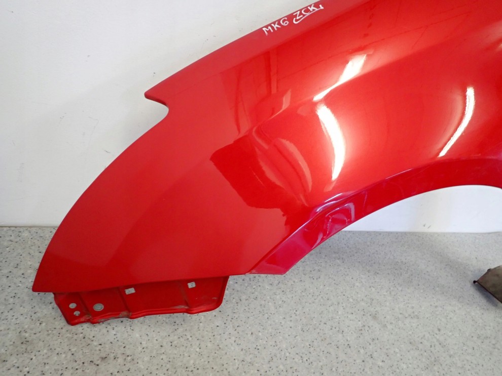 SUZUKI SWIFT MK6 05-09 BŁOTNIK PRZEDNI LEWY ZCK 7/15