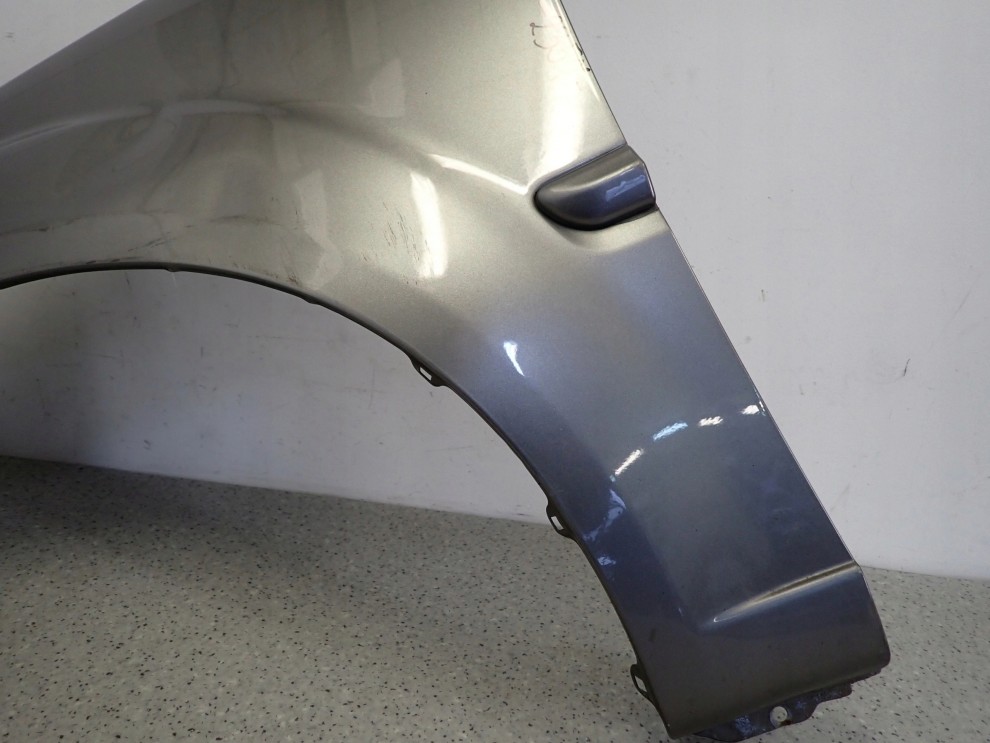KIA RIO II 09-11 BŁOTNIK PRZEDNI LEWY IM 4/12