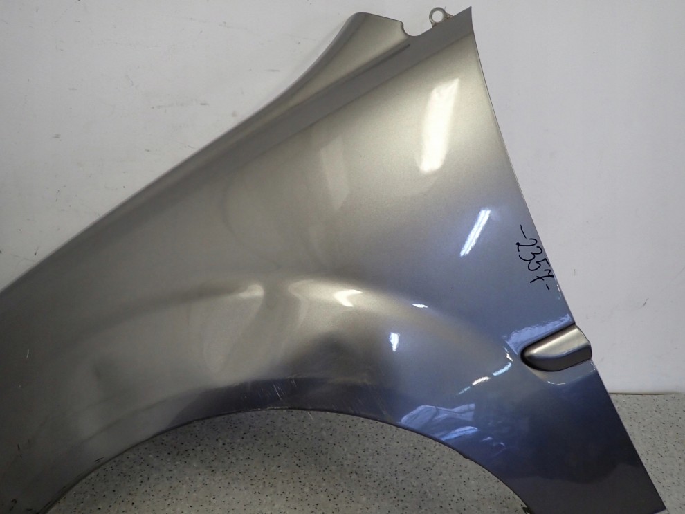 KIA RIO II 09-11 BŁOTNIK PRZEDNI LEWY IM 5/12