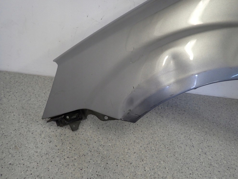 KIA RIO II 09-11 BŁOTNIK PRZEDNI LEWY IM 8/12