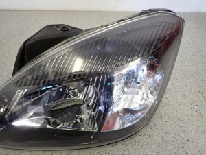 KIA RIO II 10-12 REFLEKTOR LEWY LAMPA PRZEDNIA LEWA 7/14 MINIATURA