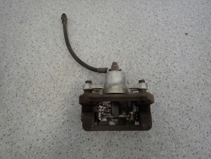 HYUNDAI i30 KIA CEED 07-12 ZACISK HAMULCOWY TYLNY LEWY 5/6 MINIATURA