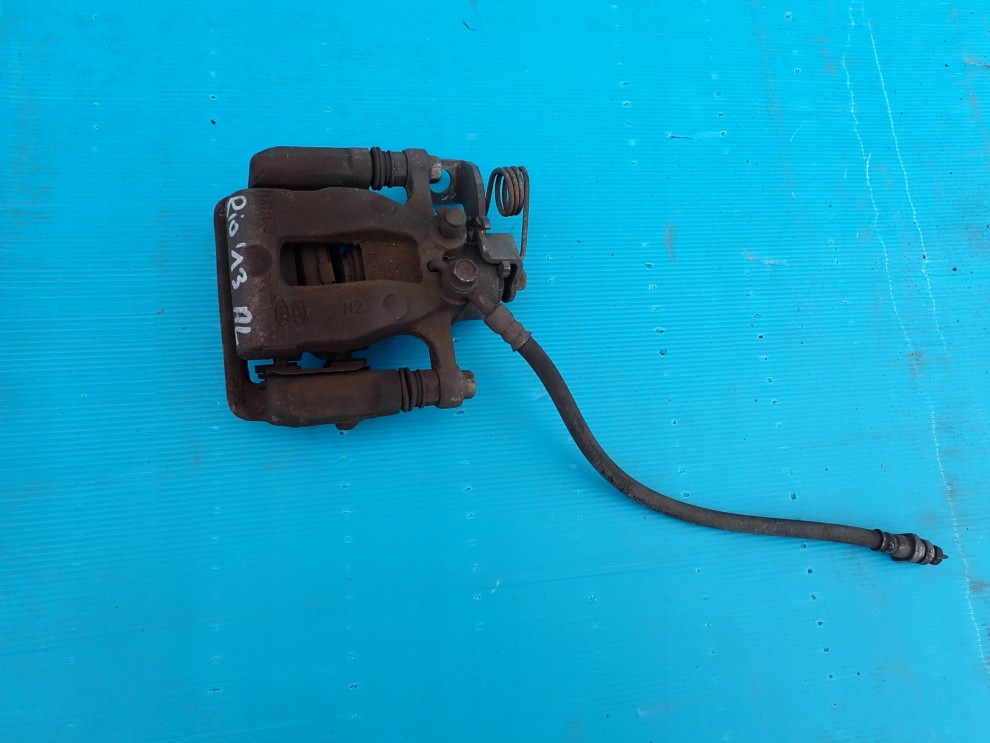 KIA RIO III HB 11-14 ZACISK TYLNY LEWY 1/3