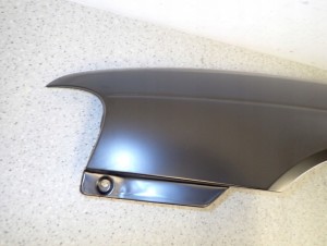 SUZUKI BALENO 95-99 BŁOTNIK PRZEDNI LEWY NOWY 5/12 MINIATURA