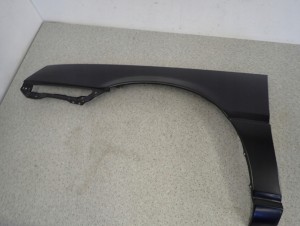 MITSUBISHI COLT LANCER 84-86 BŁOTNIK PRZEDNI LEWY 6/15 MINIATURA