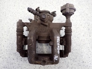 CHEVROLET ORLANDO 1.4i 10- ZACISK TYLNY LEWY